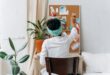woman in white long sleeve shirt sitting on chair