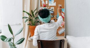 woman in white long sleeve shirt sitting on chair