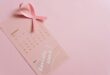 a pink calendar on pink surface
